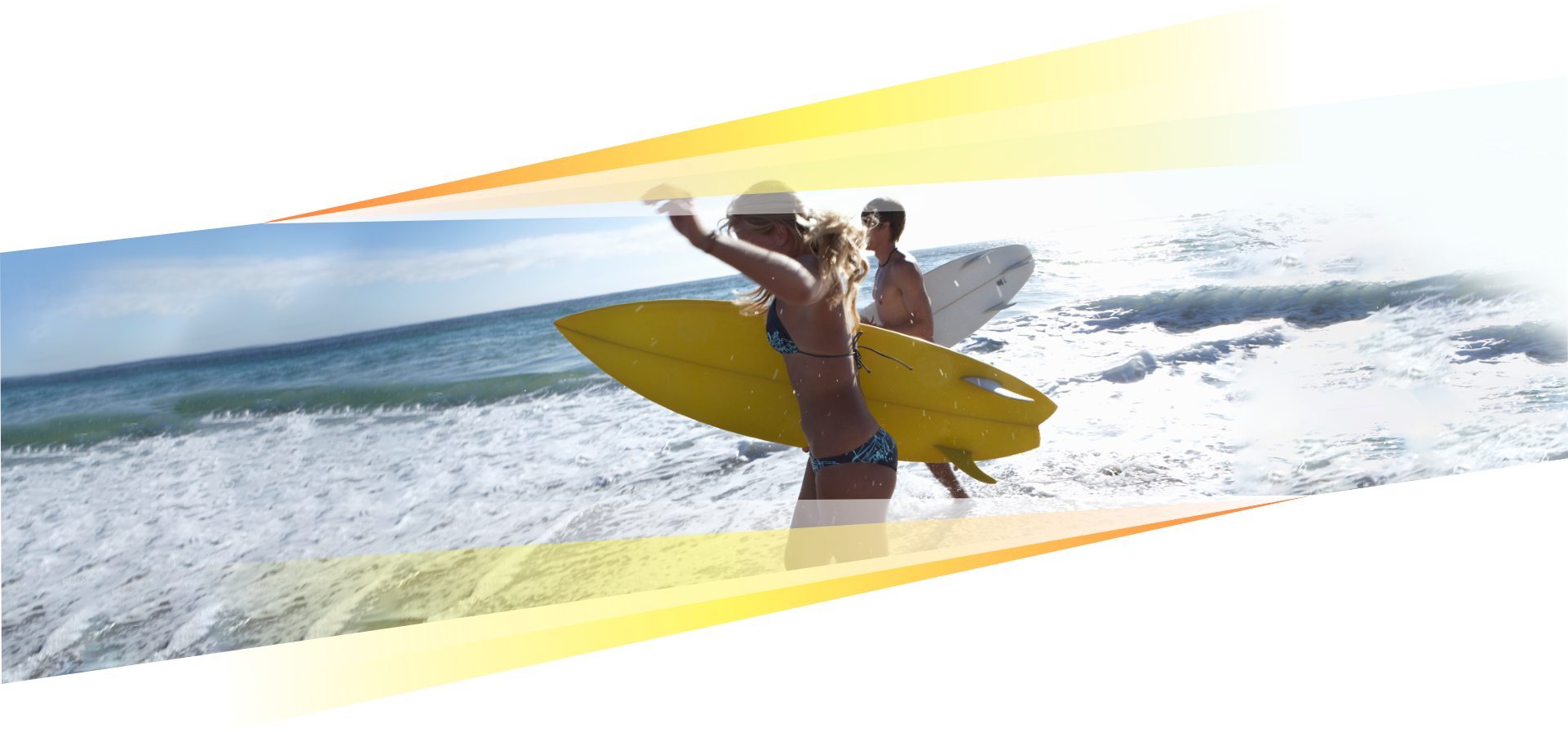 Young couple running with surfboards